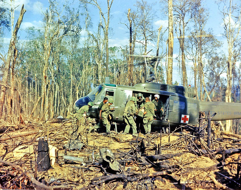 Wounded being evacuated from a jungle decimated by Agent Orange. Near Dak To, Vietnam, November 23, 1967.